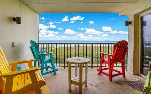 Oceanfront Beach Condo with Private Balcony, Short Walk to Pool and Beach by RedAwning
