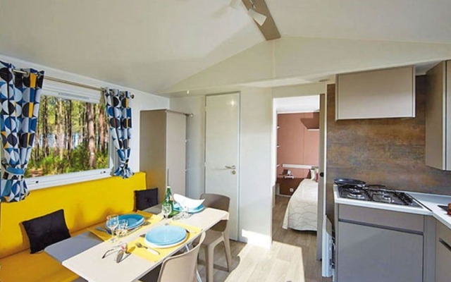 Cozy Mobile Home With Covered Terrace on a Luxury Campsite