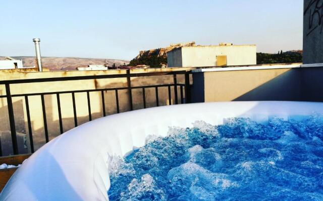AS jacuzzi on privet roof top with acropolis view