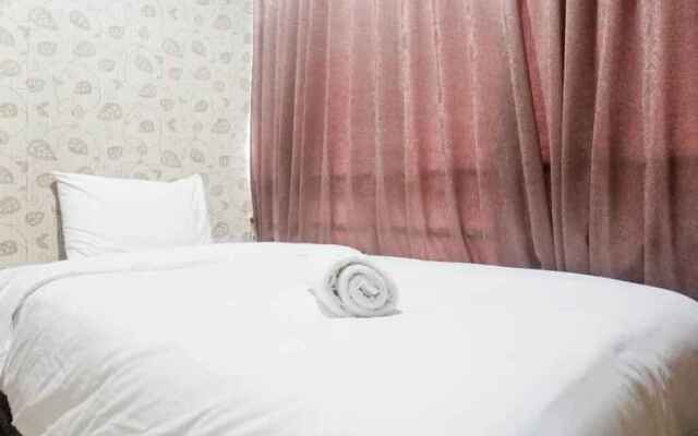 Minimalist 2BR Apartment at Tamansari Papilio By Travelio