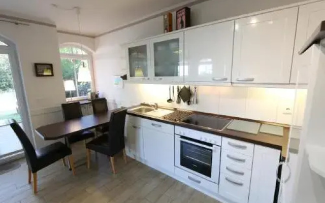 Kurparkresidenz Baabe - Ferienwohnung Meeresgarten mit Terrasse
