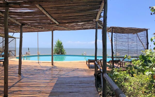 Saadani Safari Lodge - bush, river, beach