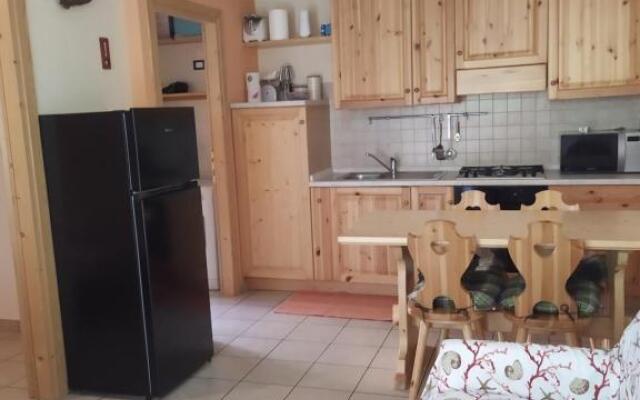 bilocale con giardino e box