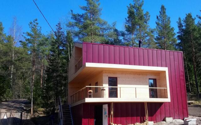 Cottage on the shore by the forest