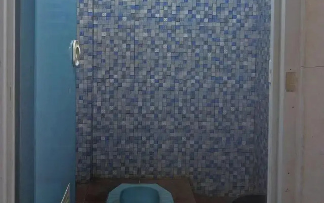 SPOT ON 91799 Sosonopan Homestay Near LANTAMAL VIII MANADO