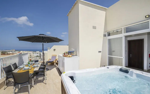 Summer Breeze Penthouse with large Terrace and Hot Tub by Getaways Malta