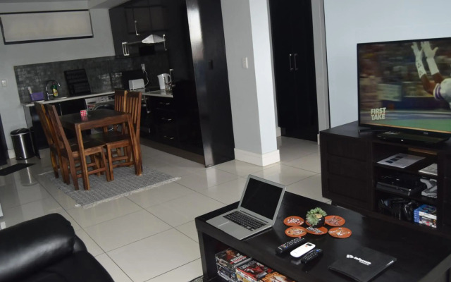 Highrise Windhoek apartment with skyline view, pool and gym