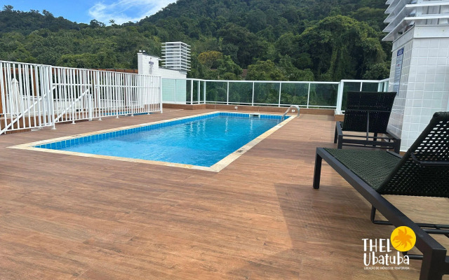 Apto completo e confortável com roupa de cama nas Toninhas  Condomínio Lumière