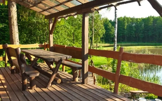 Rustic Riverside Cabin in Forest