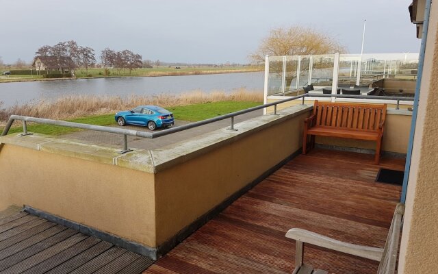Exclusive Holiday Home Floating on a Lake in Friesland