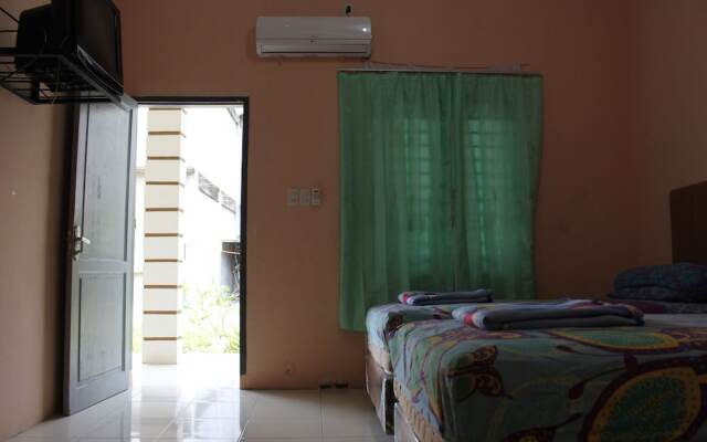 Penginapan Transit Tomato