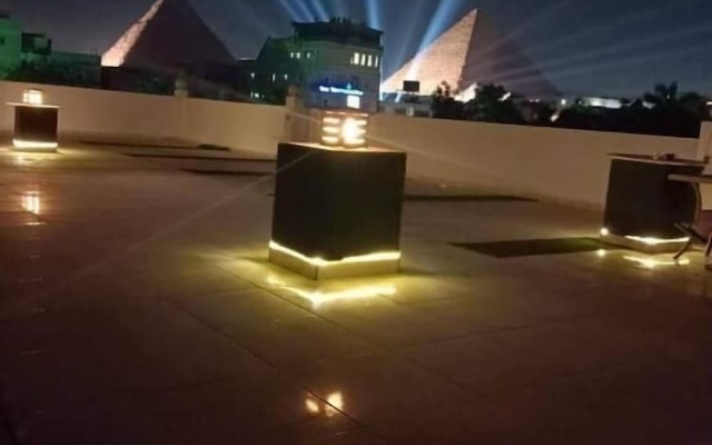 Nefertiti Pyramids View