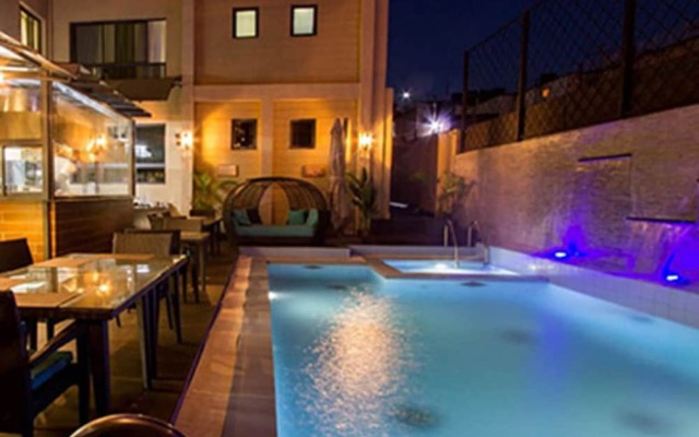 Stay at the Landmark Suites And Relax by the Pool And Enjoy the Amenities