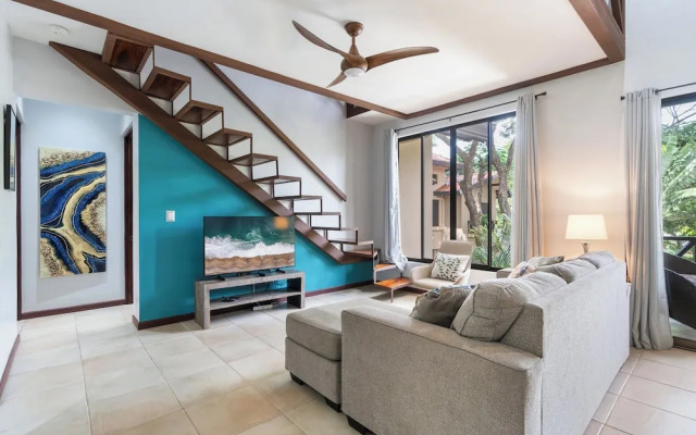 Modern Island-Themed Condo with Floor-to-Ceiling Windows & Garden and Pool Views Within Walking Distance of the Beach