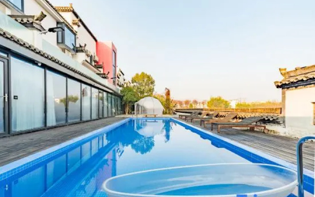 Grand Travel Lodge DESIGN Boutique Hotel(Xixi Nangu Village)
