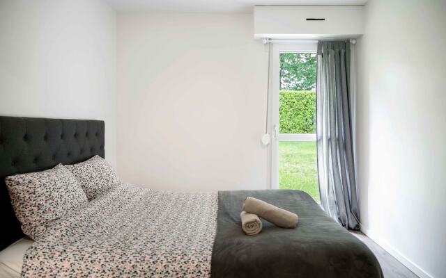 Chic Appartement avec Terrasse, Parking Privatif