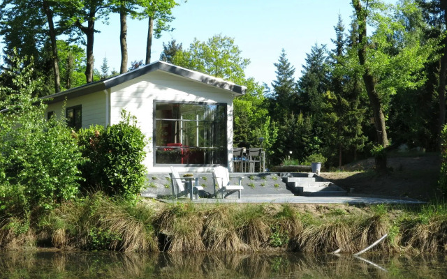 Modern chalet with two terraces and near a pond