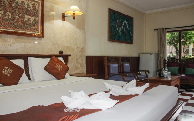 Отель Melasti Kuta Beach Hotel and Spa