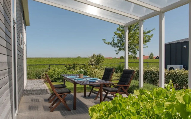 Nice Chalet with Fireplace near Oosterschelde