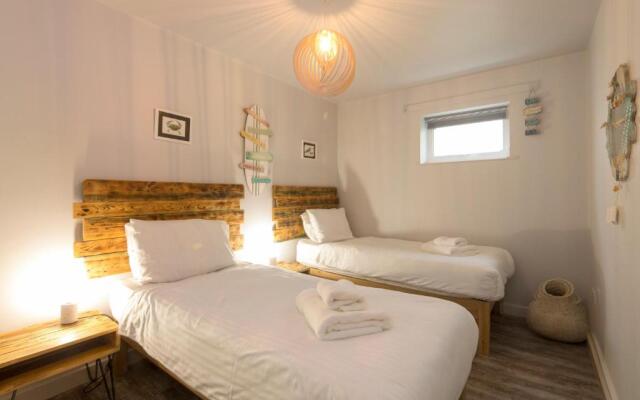 The Beach House & Porth Sands Apartments