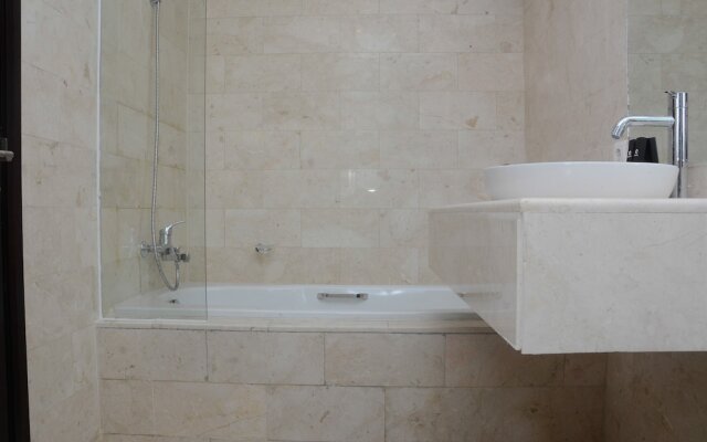 Comfy and Spacious 2BR The Masterpiece Epicentrum Apartment By Travelio