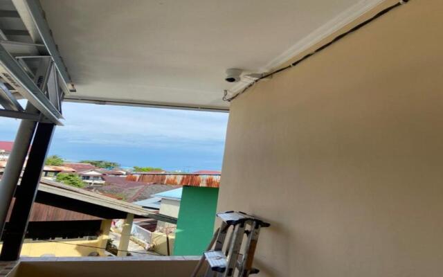 SPOT ON 91616 Kharisma Guest House