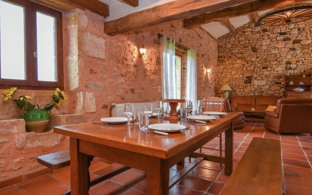 Lovely holiday home in Biron with fenced swimming pool