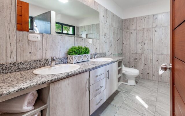 Ultramodern Townhome with an Inviting Coastal Design and Lush Outdoor Oasis with a Private Pool