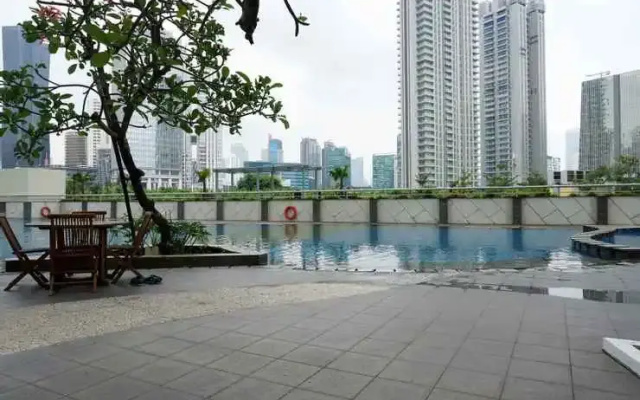Amazing 1BR at The Wave Rasuna Epicentrum By Travelio