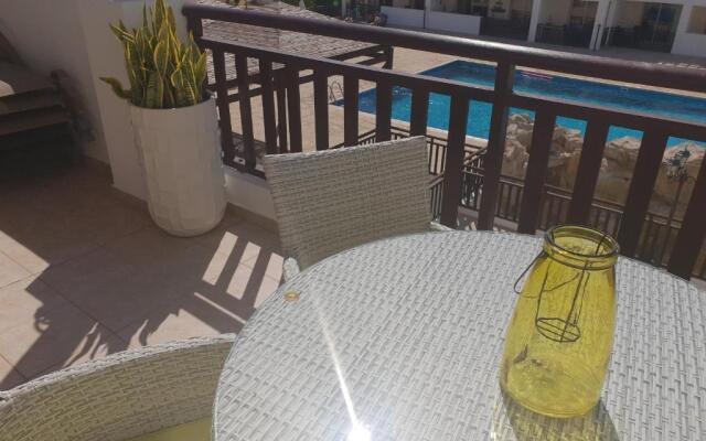 Stunning apartment C106 with balcony looking over pool