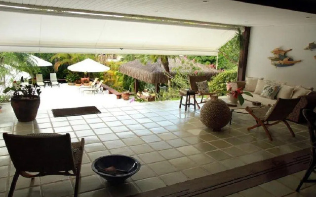 SMI012 Casa charmosa em condomínio à beira mar