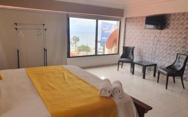 Malecon Rooms y Hotel