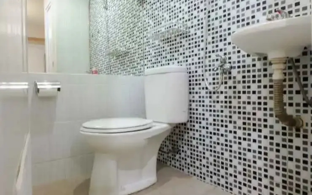 Cozy 2BR Green Pramuka Apartment By Travelio