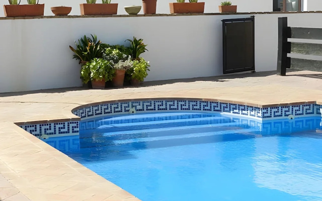 Apartamentos piscina compartida
