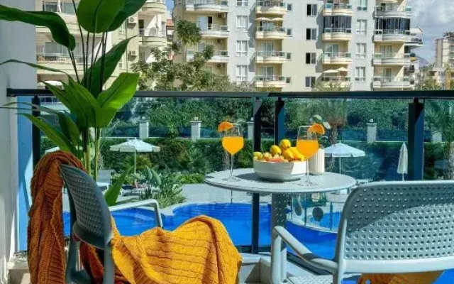 1+1 Apartment Qoople Aria 07 in the center of Alanya