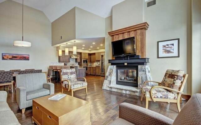 Expansive 4 Bedroom Ski in, Ski out One Ski Hill Residence Located at the Base of Peak 8 with Beautiful Views