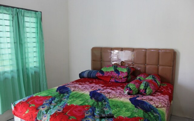 Penginapan Transit Tomato