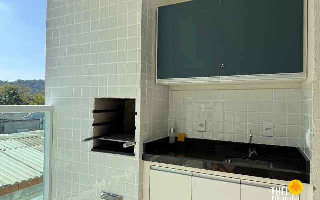 Apto completo e confortável com roupa de cama nas Toninhas  Condomínio Lumière