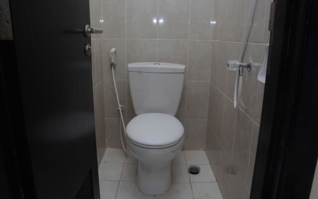 Comfy and Spacious 2BR The Masterpiece Epicentrum Apartment By Travelio