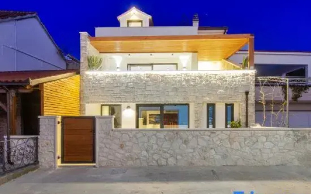 Seafront villa Kupinica with private indoor Pool