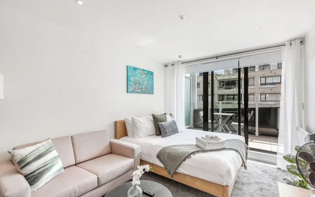 Central Studio + Private Balcony!