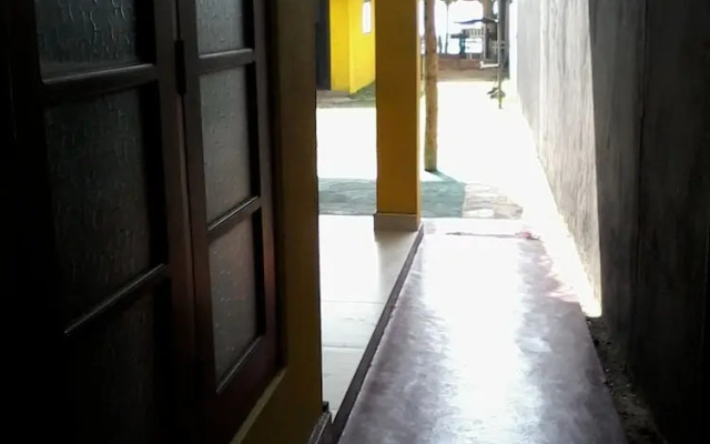 Malika's Yellow House