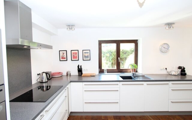 Quaint Chalet in Kirchberg with Terrace, Garden, Ski Storage