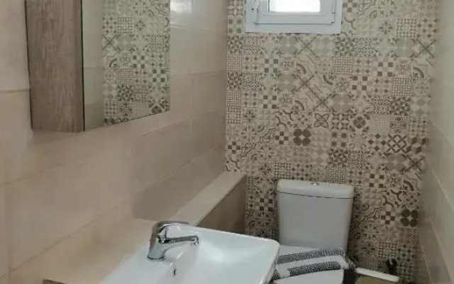 Marina's Apartments - White & Stone Apartment
