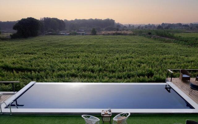 SaffronStays Onellaa, Nashik - infinity pool villa surrounded by a vineyard