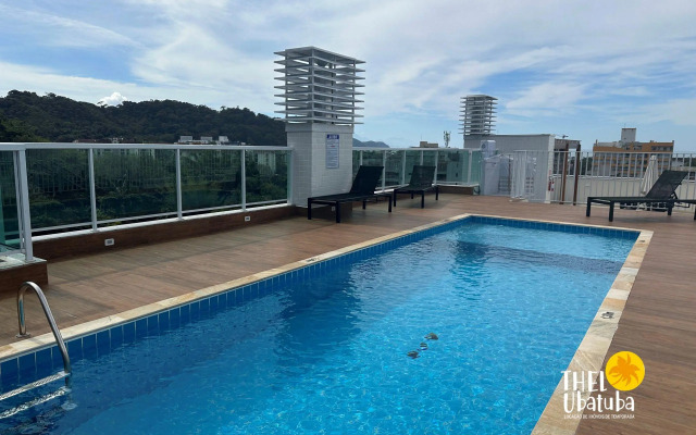 Apto completo e confortável com roupa de cama nas Toninhas  Condomínio Lumière