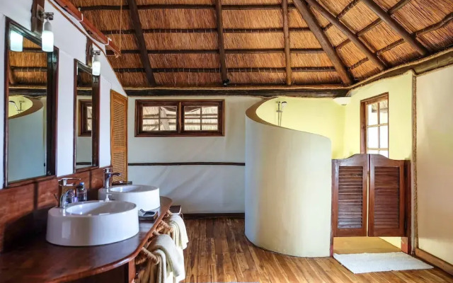 Saadani Safari Lodge - bush, river, beach