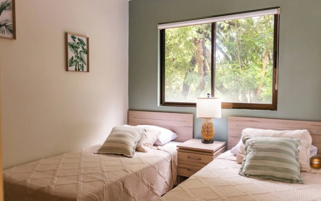 Cozy Condo with Panoramic Hillside Views from Rooftop Terrace and Short Walk to Beach