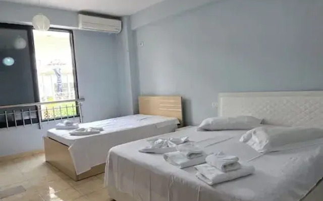 Tirent Apartment - Cozy Bedrooms Stay by Golem Beach.
