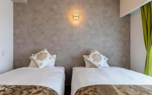 Mr.KINJO in front of Manza Beach